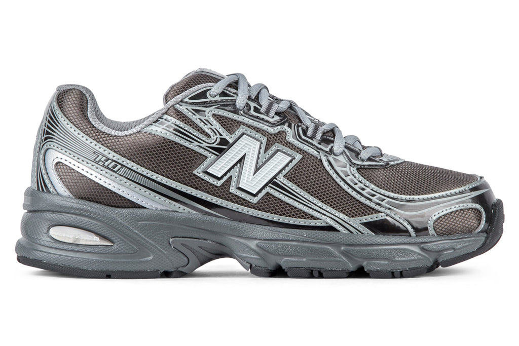 New Balance U7407YI - Castlerock/Black Metallic